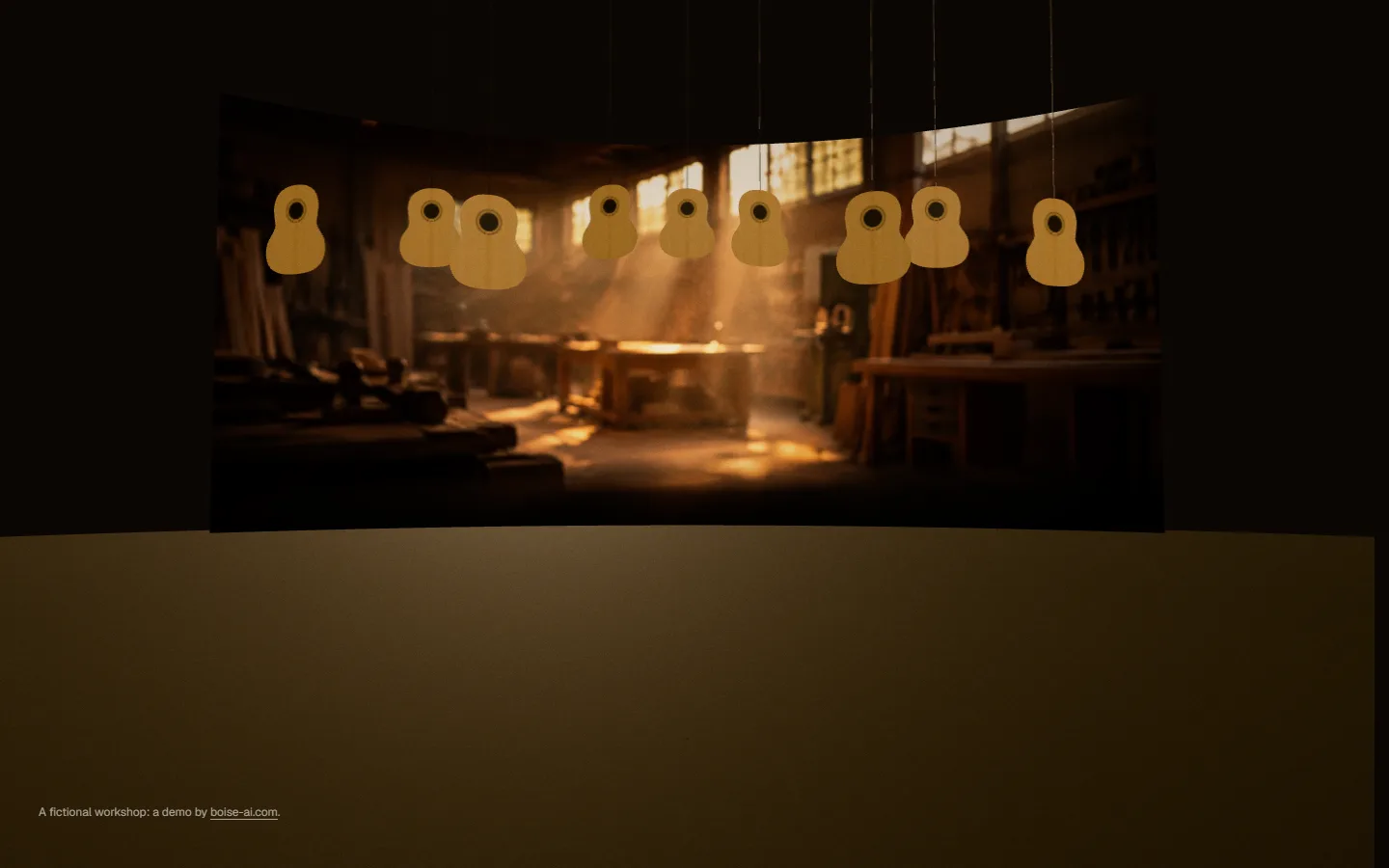 A dim workshop in warm dawn light, with unfinished guitar tops hanging from the ceiling.